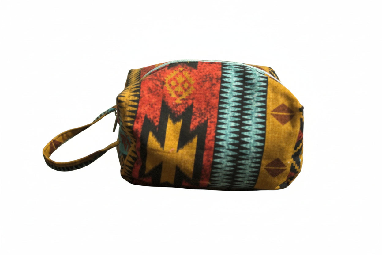 Colorful patterned pouch on a marble surface with a blurred background